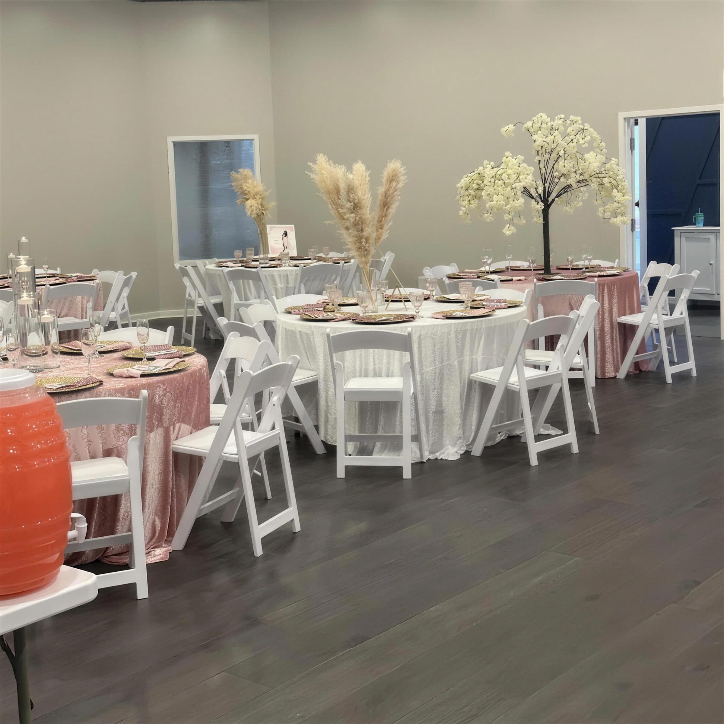 Baby shower seating in dusty rose and ivory - crushed velvet linens, gold beaded chargers, pampas grass and blossom tree centerpieces at The Cove at St. Johns, Fruit Cove, St. Johns County FL