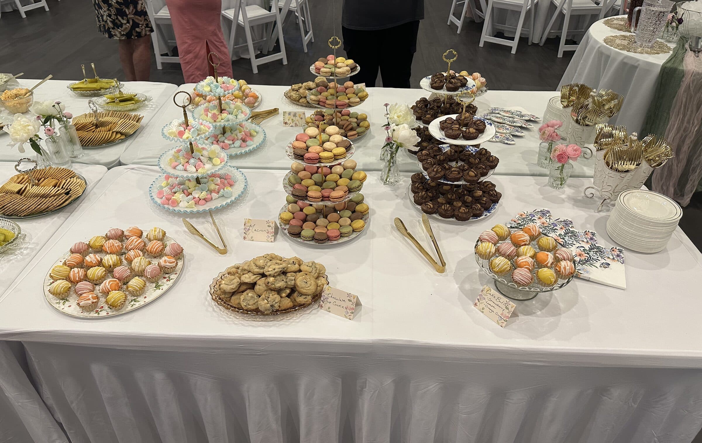 Dessert table with tiered stands of macarons, meringues and brownie bites, plus cake balls and cookies at a bridal tea at The Cove at St. Johns, Fruit Cove, St. Johns County FL