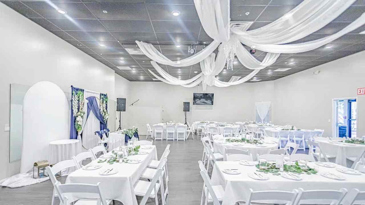 Wedding reception set-up with white ceiling draping and round tables at The Cove at St. Johns, Fruit Cove FL